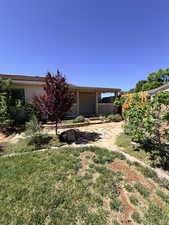 View of yard featuring covered porch