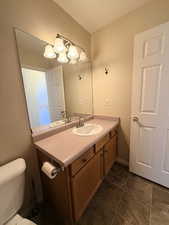 Bathroom with vanity and toilet