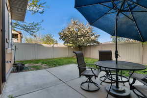 Fenced backyard with a patio and outdoor dining space