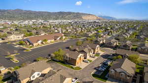 Aerial view of residential area featuring a mountainous background
