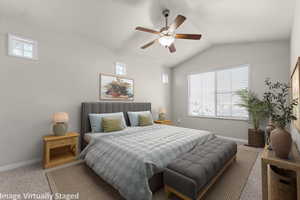 Virtually Staged. Carpeted bedroom featuring multiple windows, lofted ceiling, and a ceiling fan