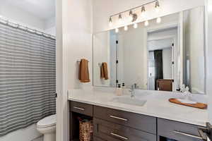 Full bath with vanity and toilet