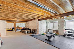 Workout room featuring concrete floors
