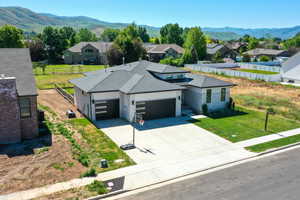Aerial view of residential area featuring a mountainous background