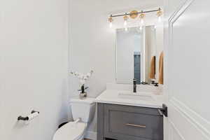 Half bath with toilet and vanity