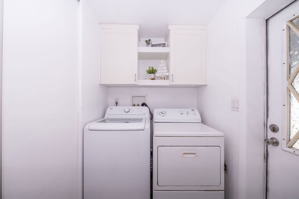 Laundry area with cabinet space and washer and dryer