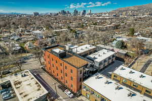 Aerial view of skyline and a mountainous background