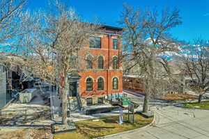 Italianate home with brick siding
