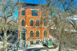 Italianate home with brick siding