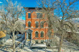 Italianate house featuring brick siding