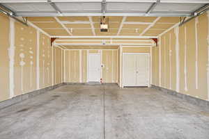 Garage featuring a garage door opener