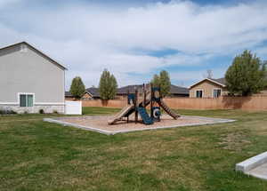 Community playground featuring a yard