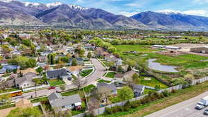 Aerial view of residential area featuring a water and mountain view