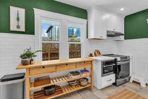Kitchen with white cabinets and stainless steel appliances