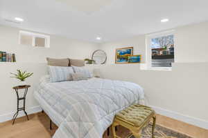 Bedroom with light wood-style floors and recessed lighting