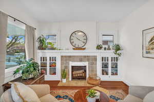 Living room featuring wood finished floors and a fireplace