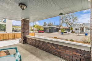 Covered porch with a residential view