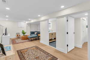 Sitting room featuring recessed lighting and light wood finished floors