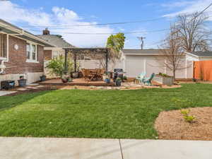 Fenced backyard featuring a patio area and a wooden deck