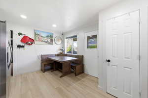 Dining area featuring light wood-type flooring and recessed lighting