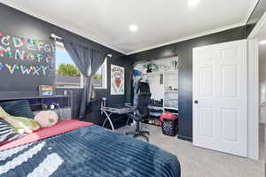 Bedroom featuring a closet and light carpet