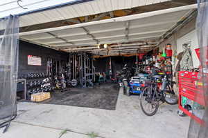 Garage featuring concrete block wall