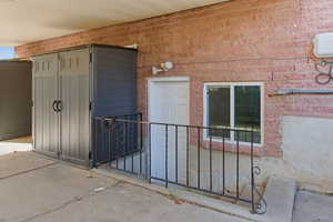 Doorway to property with brick siding