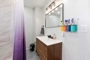 Bathroom with vanity and a shower with curtain