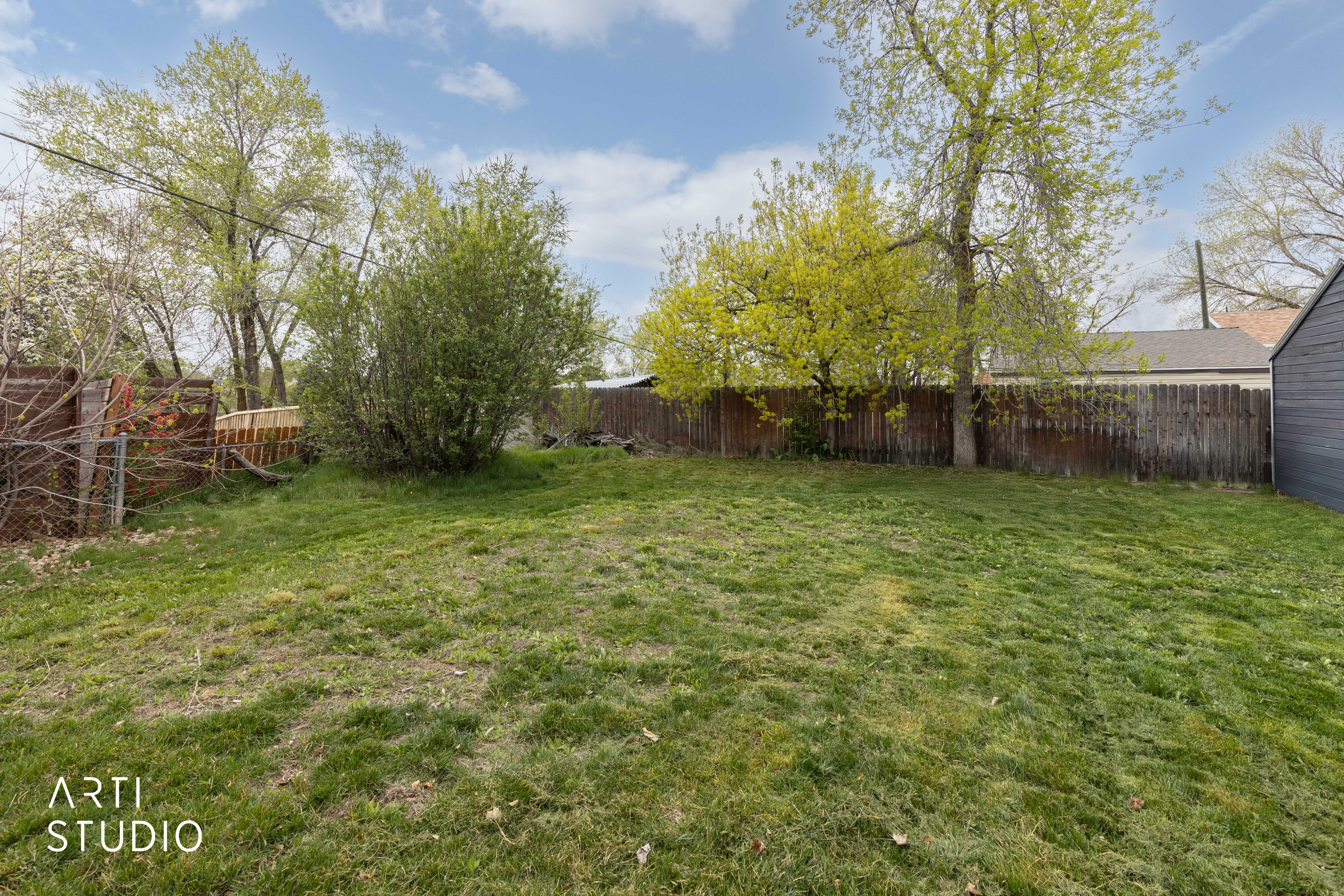 View of fenced backyard