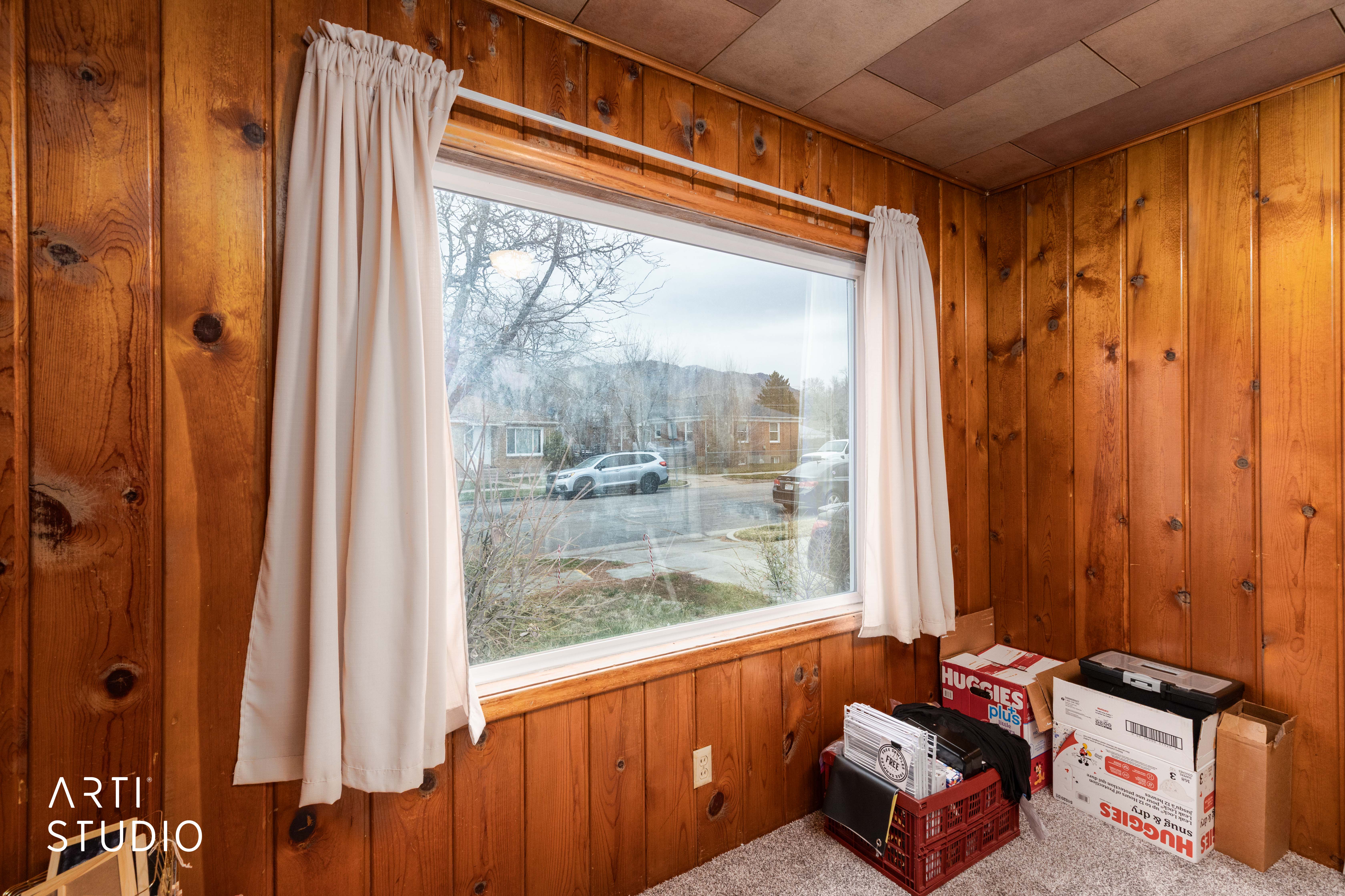 Detailed view of wooden walls and carpet flooring