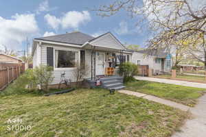 View of front of home with roof with shingles