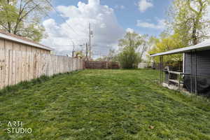 View of fenced backyard