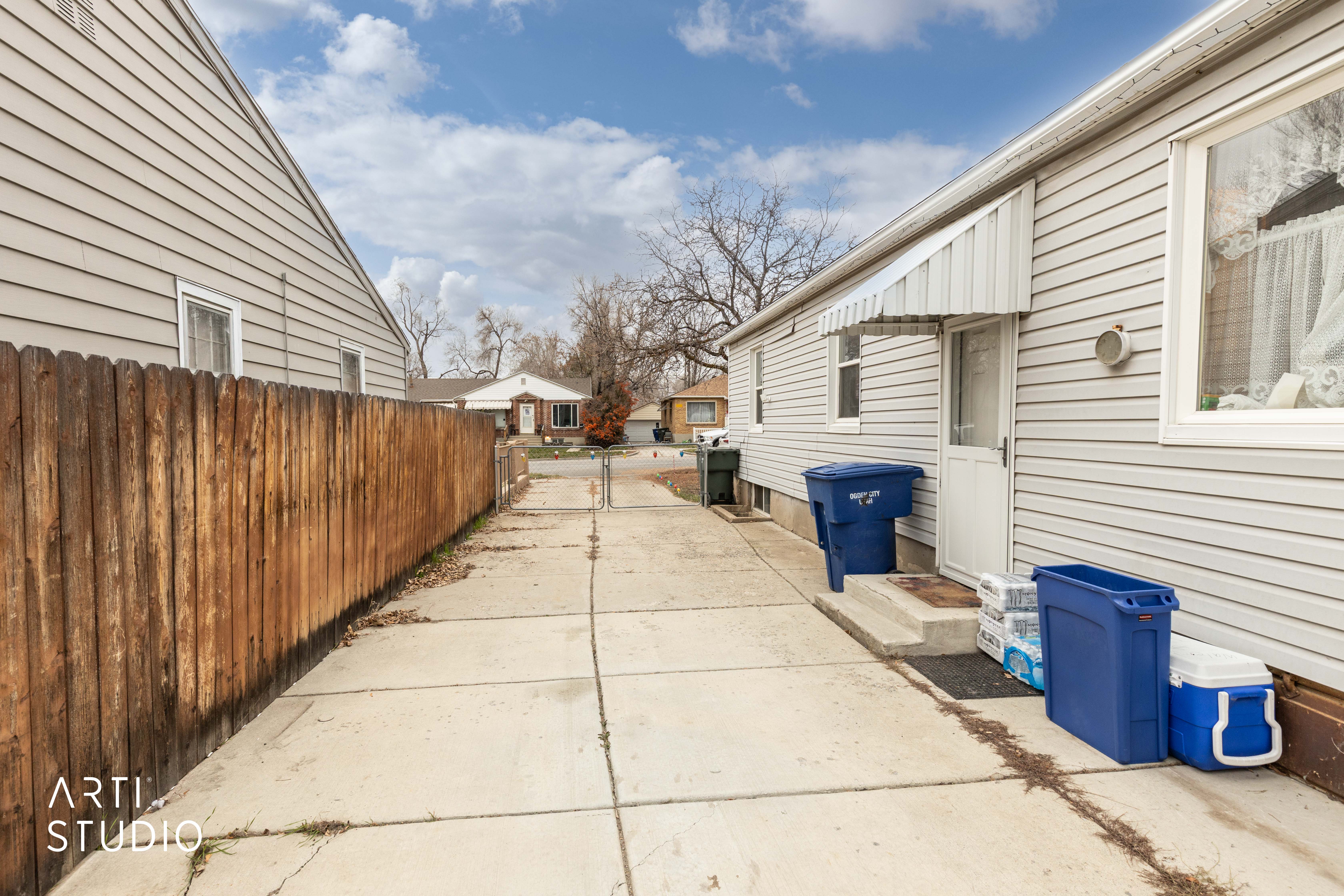 View of side of home with a patio area