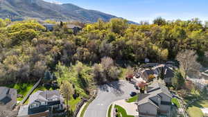 Aerial perspective of suburban area featuring a mountain backdrop