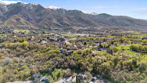View of mountain backdrop featuring nearby suburban area