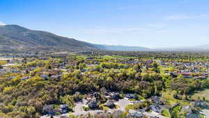 Aerial perspective of suburban area with a mountainous background