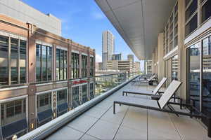 Balcony featuring a view of city