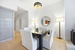 Dining area with light wood finished floors