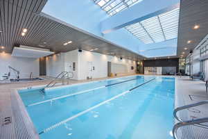 Indoor pool featuring a patio area