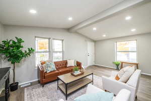 Living room featuring recessed lighting, wood finished floors, and beamed ceiling