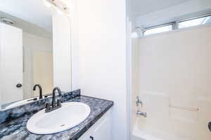 Full bath with vanity and  shower combination