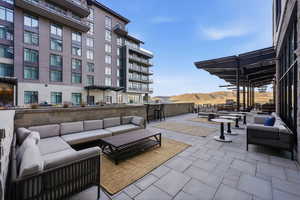 View of patio with outdoor furniture and a mountain view