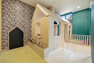 Hallway featuring an upstairs landing