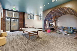 Game room with recessed lighting and vaulted ceiling