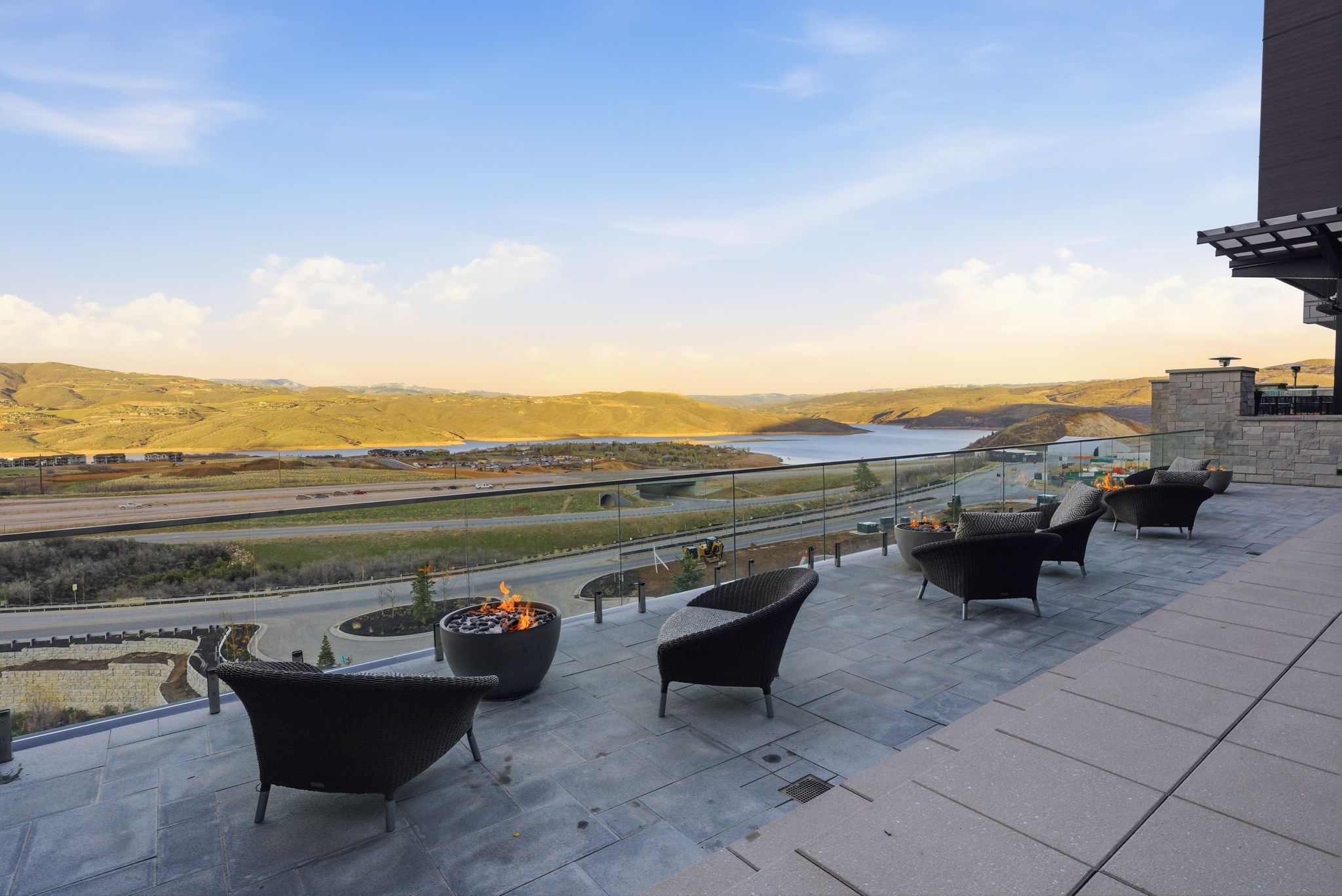 Patio terrace at dusk featuring a patio area, a mountain view, and an outdoor living space with a fire pit