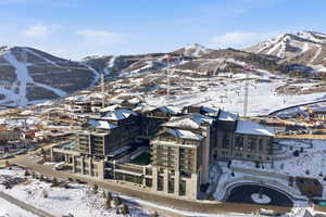 Snowy aerial view featuring a mountain view