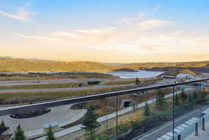 Balcony at dusk featuring a mountain view