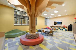 Lobby with recessed lighting and wallpapered walls