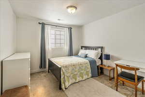 Carpeted bedroom with baseboards
