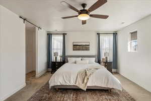 Bedroom with carpet and ceiling fan